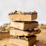 Across photo of stacked Homemade Peanut Butter Protein Bars recipe.