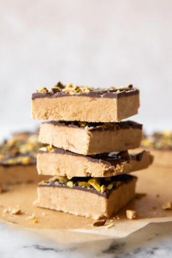 Across photo of stacked Homemade Peanut Butter Protein Bars recipe.