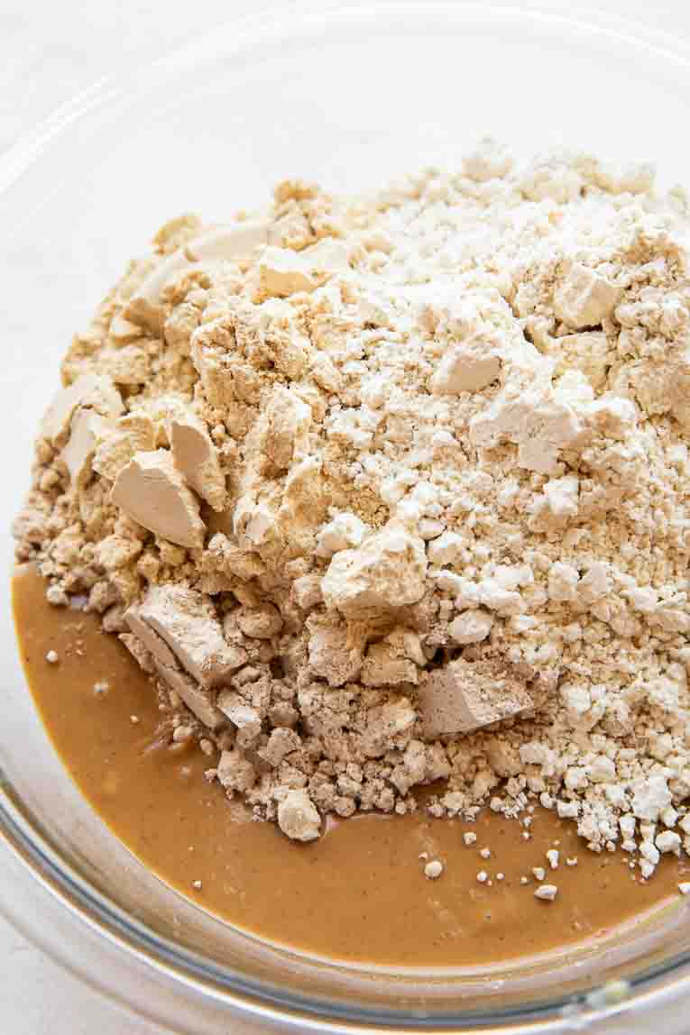 4 ingredients in a large bowl for homemade protein bars.