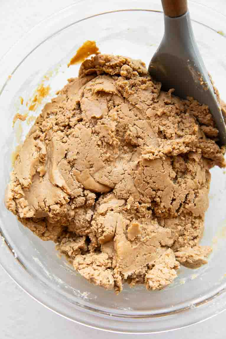 Peanut butter protein bar dough being mixed.