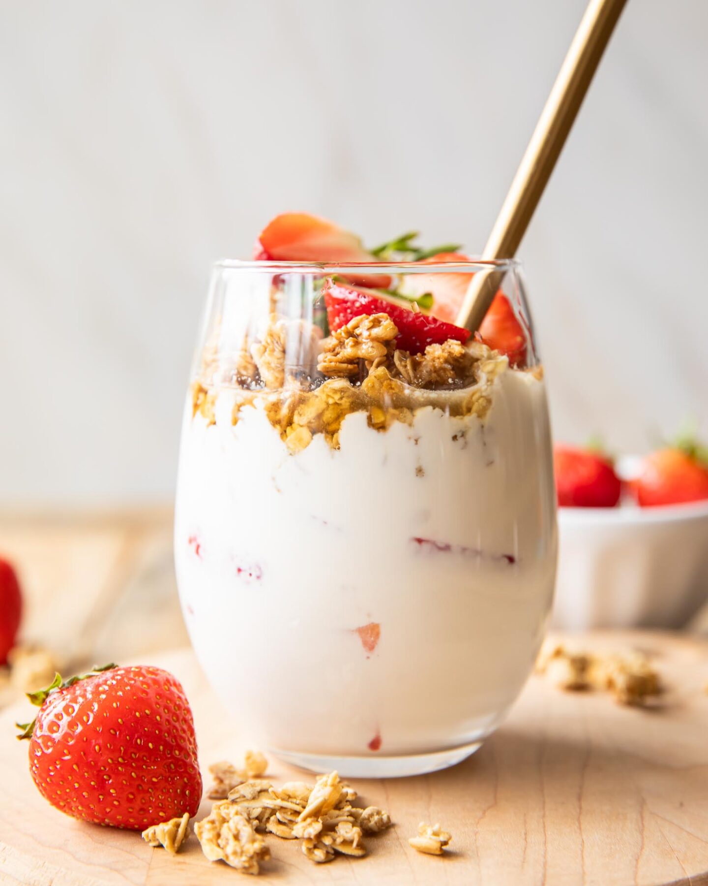 Across photo of Strawberry Cheesecake Breakfast Parfait in a glass.