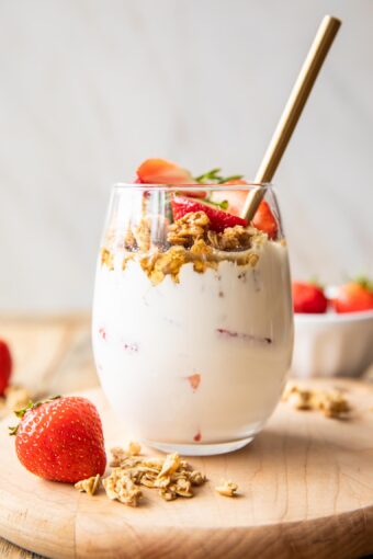 Across photo of Strawberry Cheesecake Breakfast Parfait in a glass.
