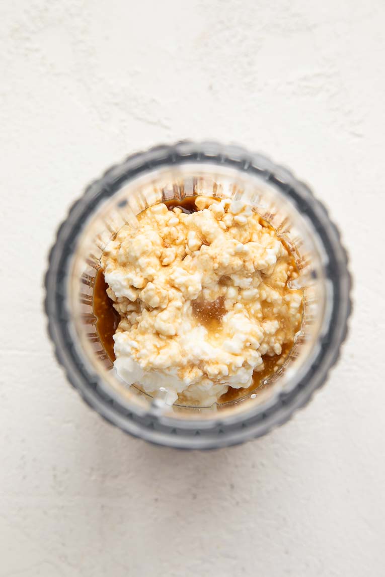 Cottage cheese, maple syrup, vanilla in a blender.