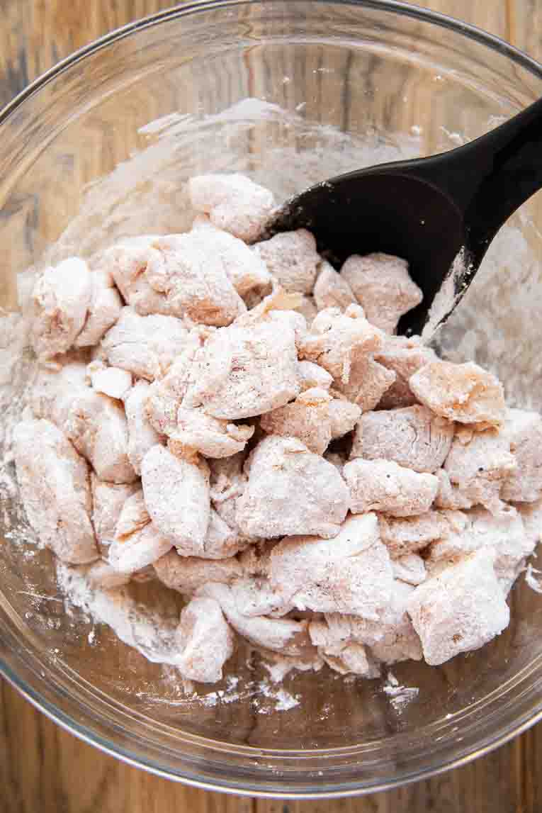 Chicken tossed in seasoning and starch.