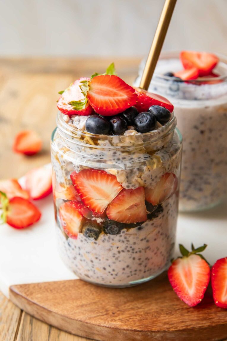 Angled photo of mixed Berry Overnight Oats in jars.