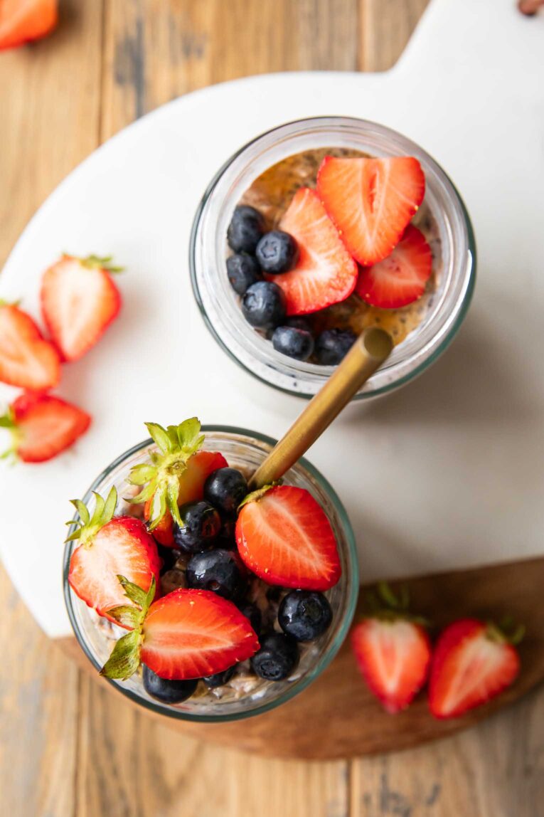 Top photo of Berry Overnight Oats with strawberries and blueberries.