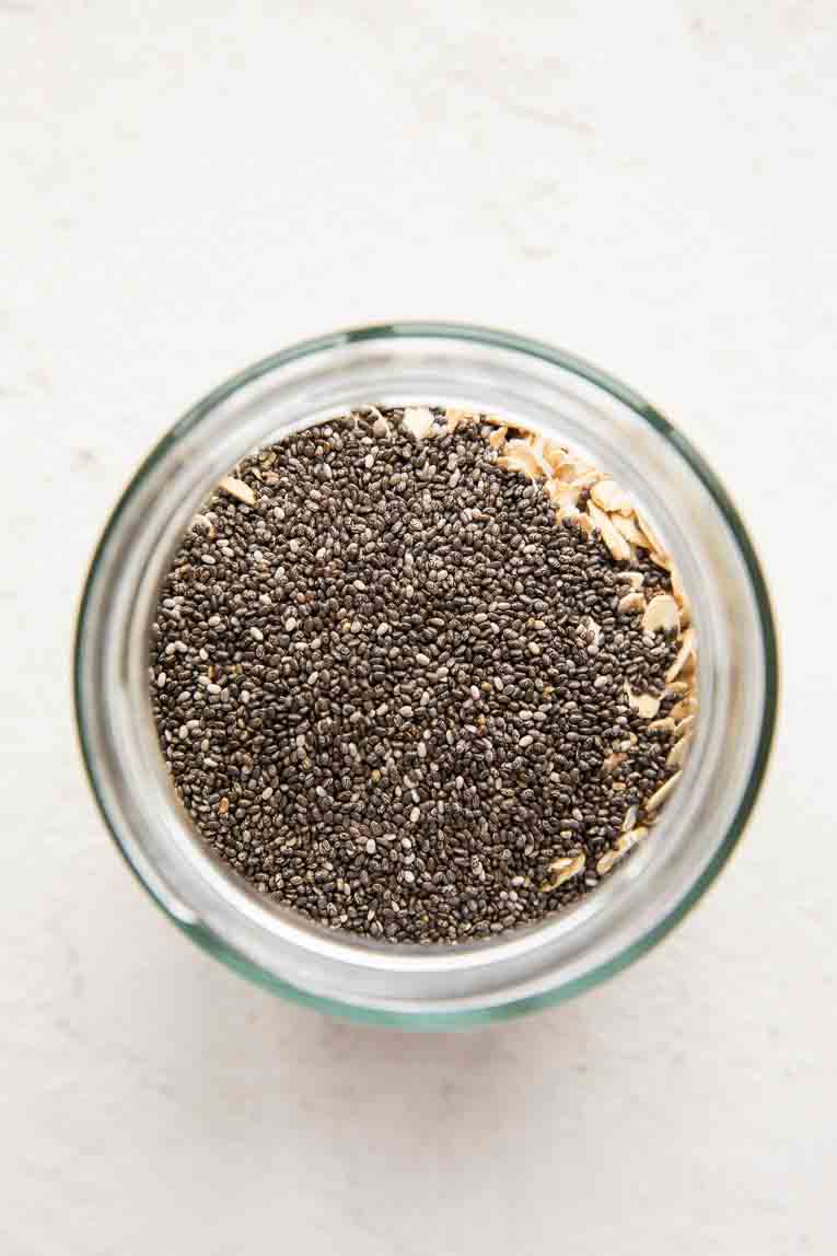 Chia seeds and rolled oats in a jar.