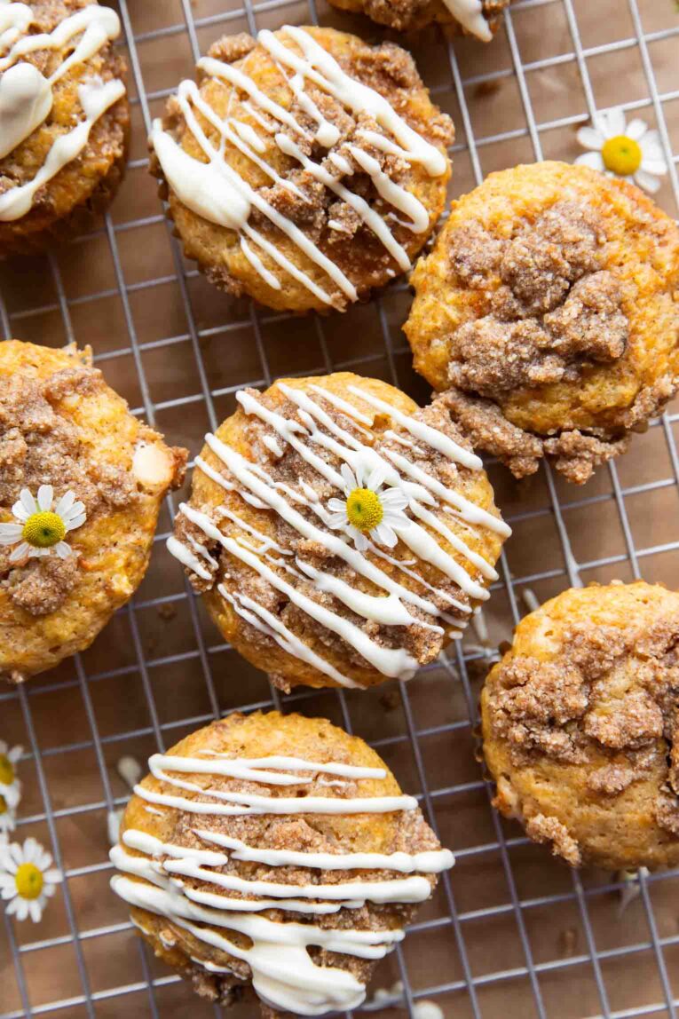 Close up of Carrot Cake Muffins with streusel on a cooling rack.