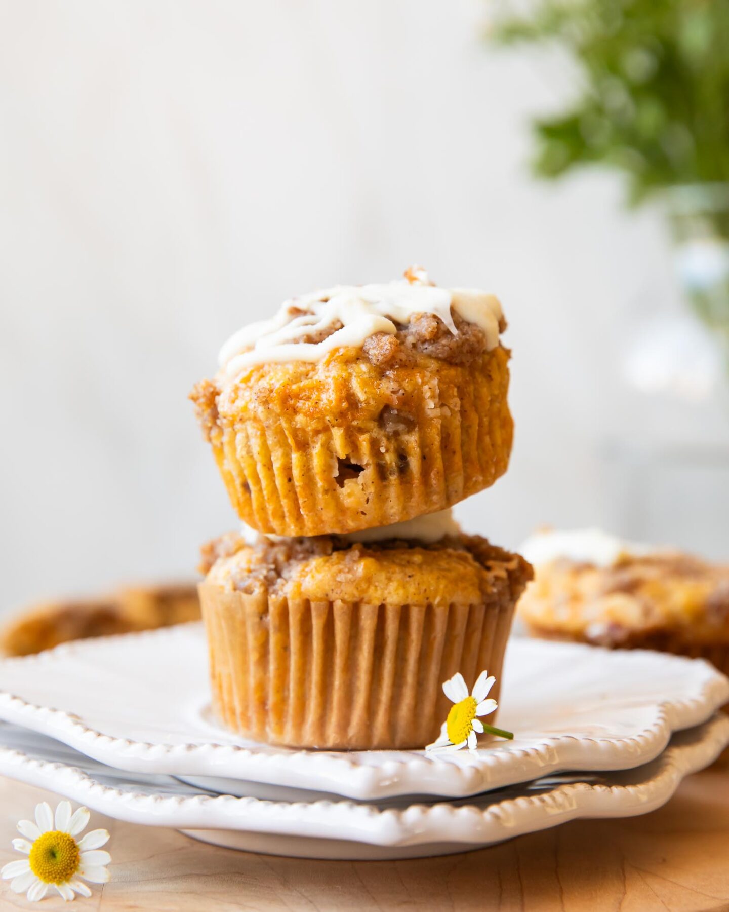Across photo of stack of Carrot Cake Muffins.
