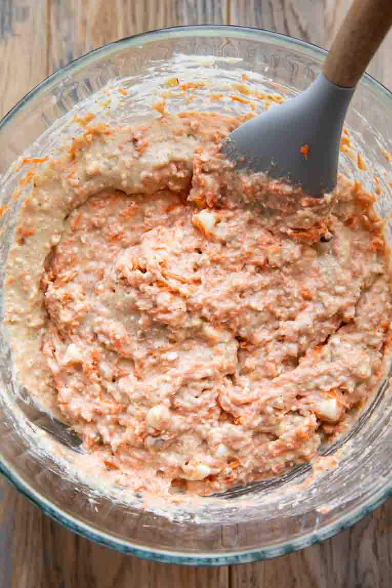 Carrot Cake Muffin batter with grated carrots and coconut.
