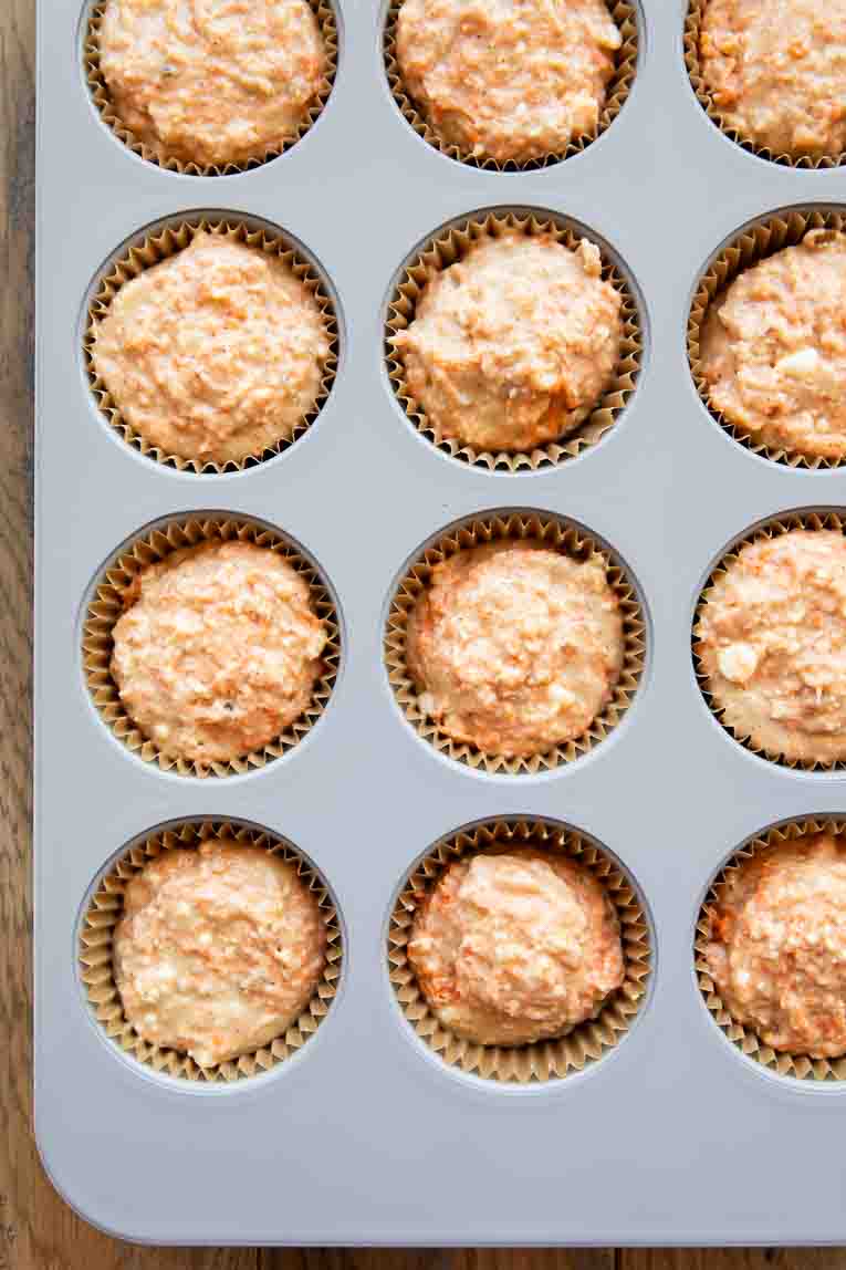 Carrot Cake Muffin batter in a muffin tin.