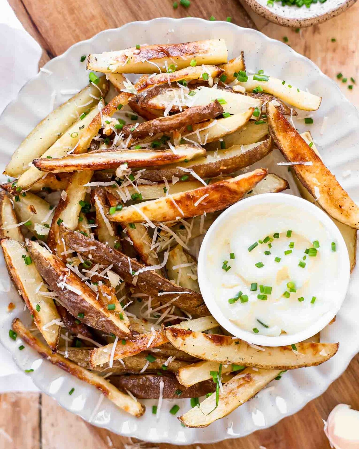 Parmesan Garlic Truffle Fries recipe on a plate.