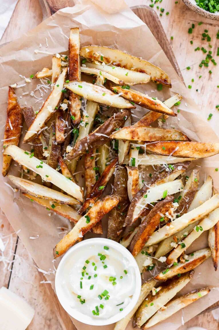 Garlic Truffle Fries recipes on a baking sheet with parchment paper.