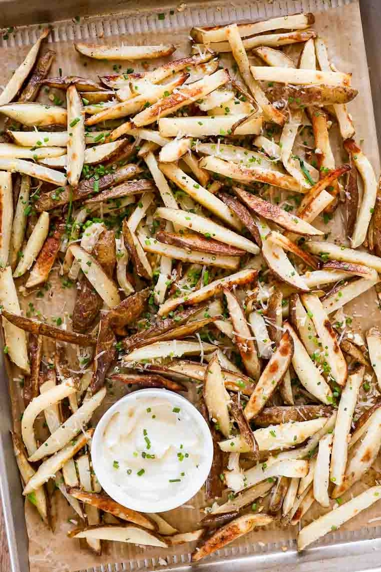 Baked truffle fries recipe on parchment paper.