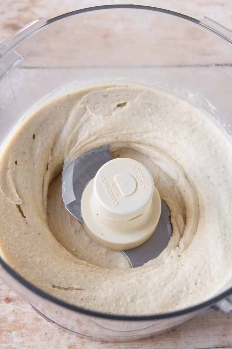 Blended hummus in a food processor.