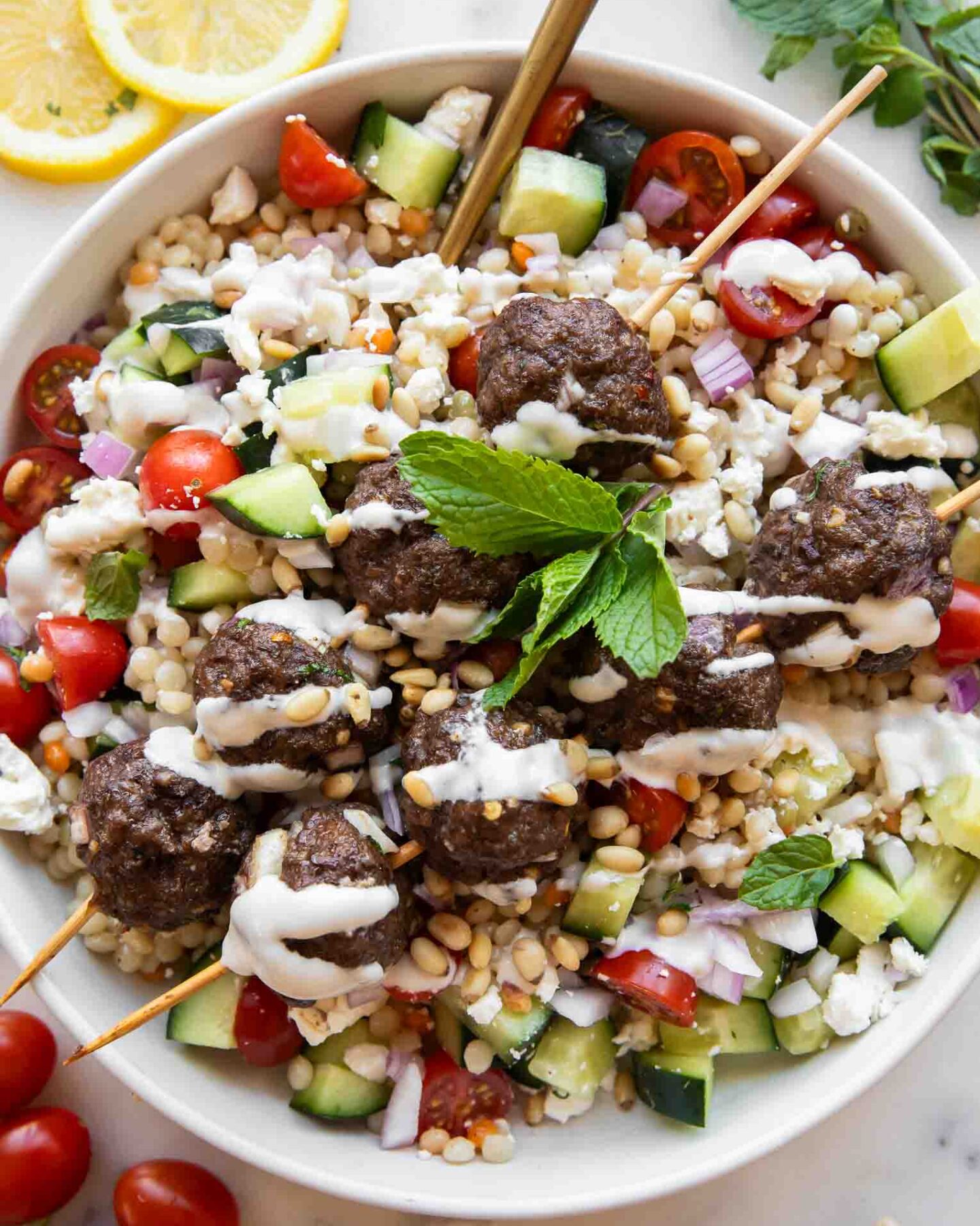 Top photo of Mediterranean Salad Bowl w/ Lebanese Meatballs.