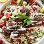 Top photo of Mediterranean Salad Bowl w/ Lebanese Meatballs.
