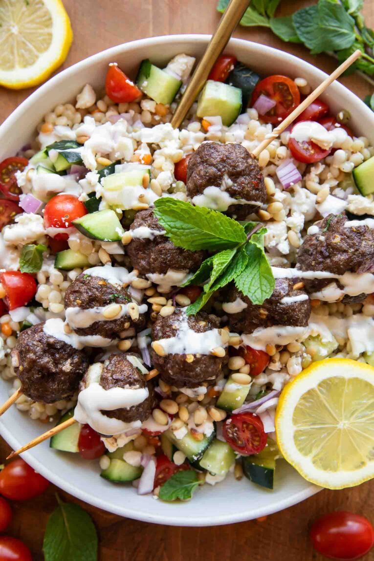 Closeup of Mediterranean meatball salad in a large bowl.