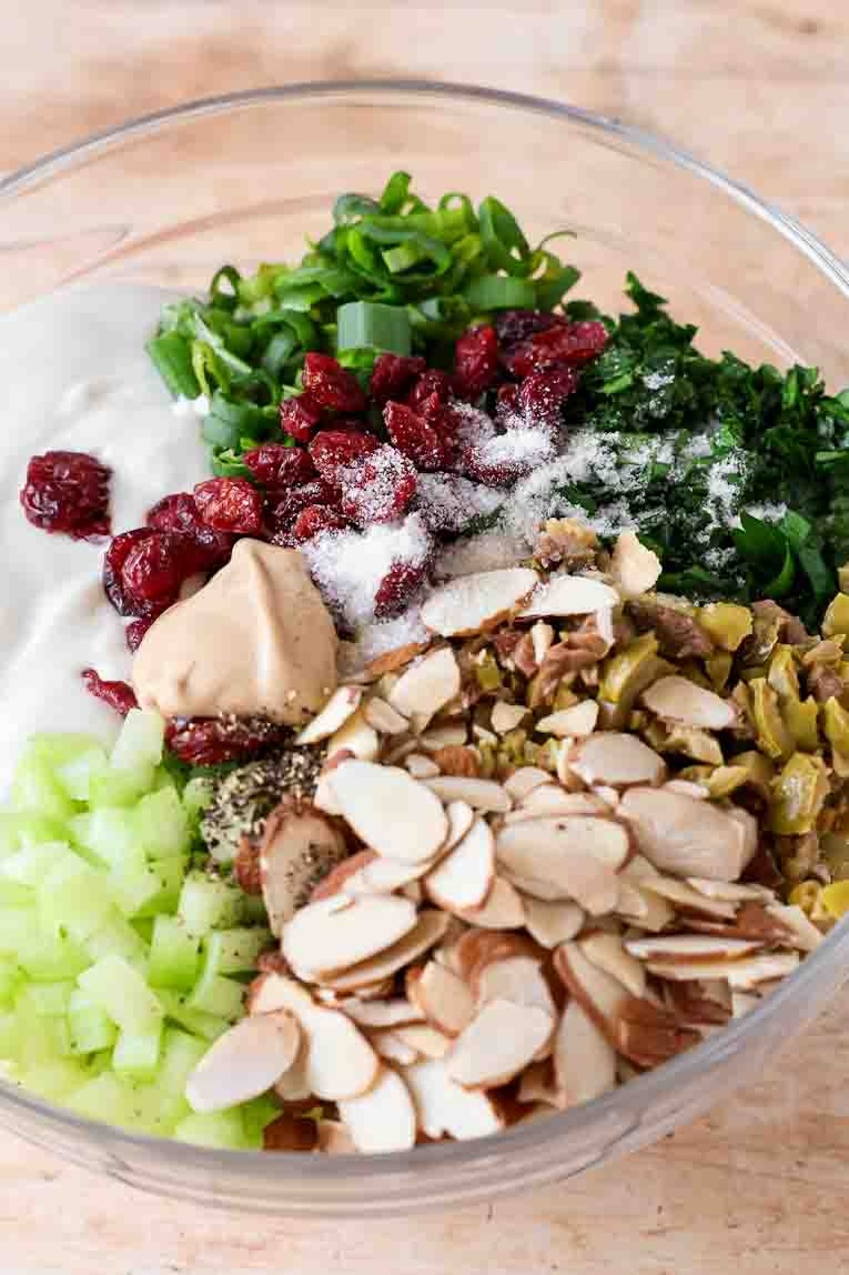 Ingredients for healthy chicken salad in a large bowl.