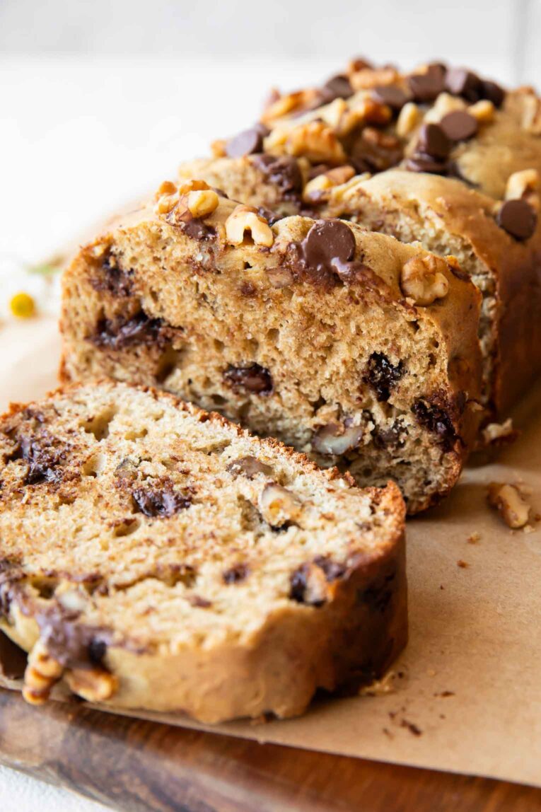Sliced date cake on a cutting board.