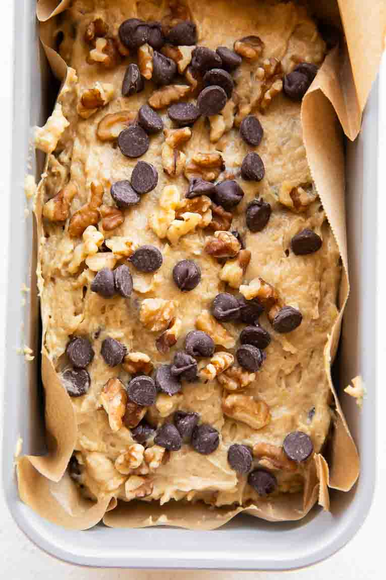 Date walnut cake batter in a loaf pan.