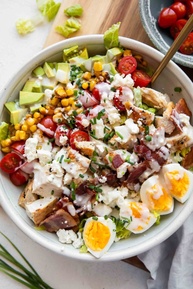Healthy Chicken Cobb Salad with dressing.