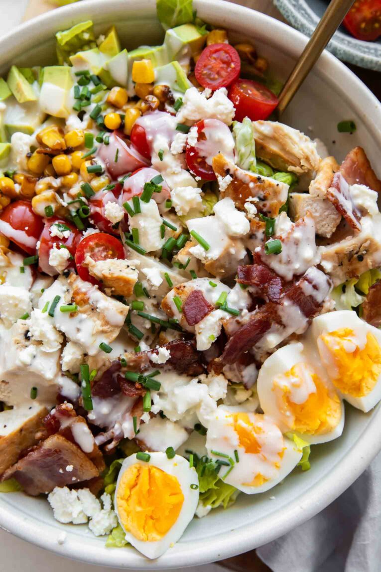 Close up of cobb salad with grilled chicken.