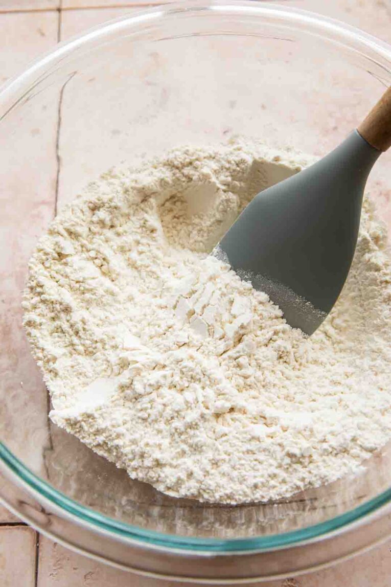Dry ingredients mixed in a mixing bowl for Lemon Blueberry Muffins.