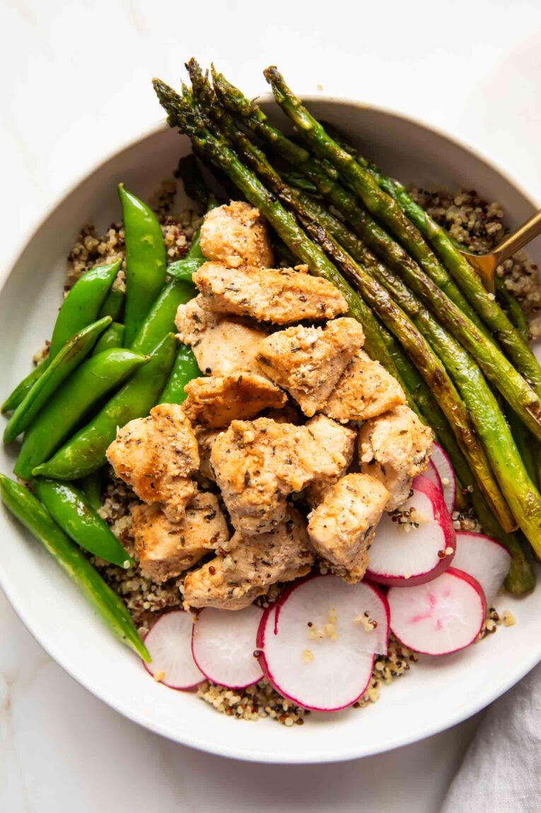 Lemon pepper chicken recipe with veggies over quinoa.