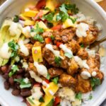 Mango Habanero Chicken Bowls with sauce drizzle.