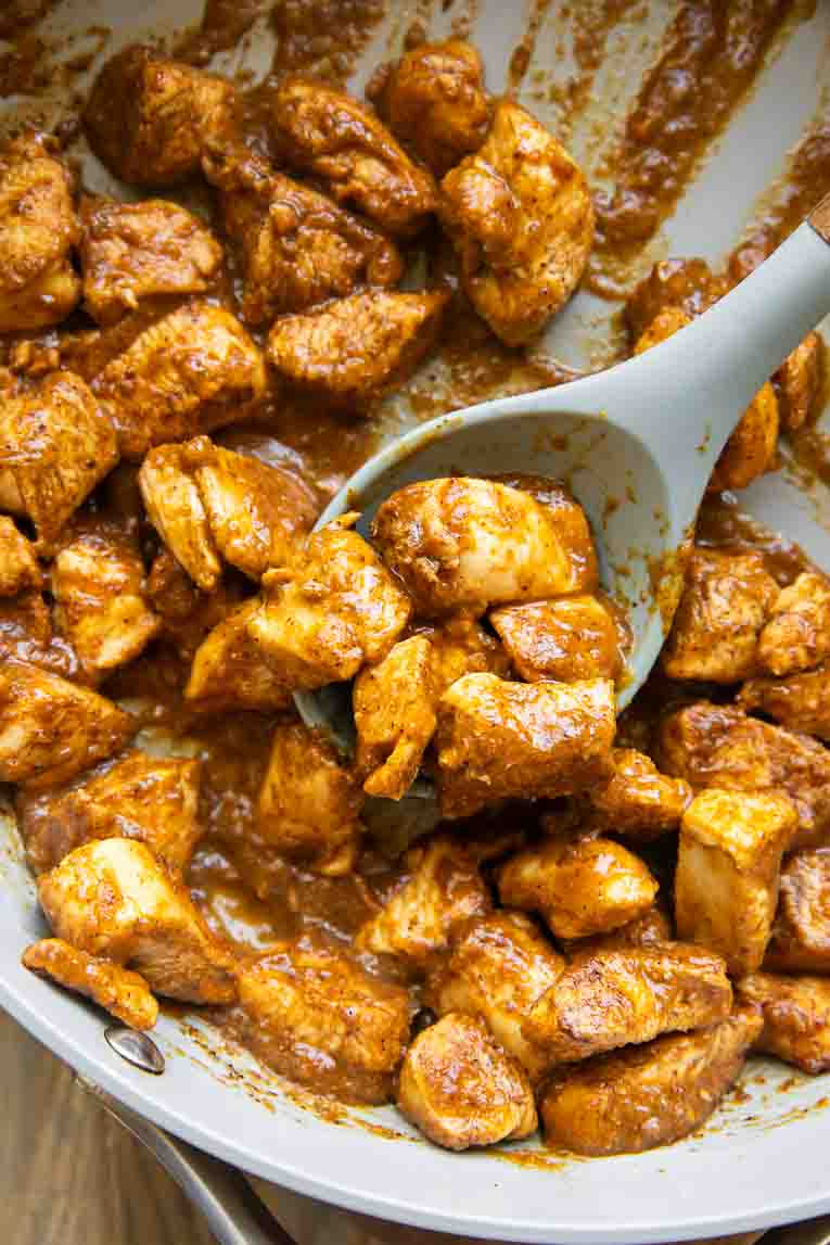 Mango habanero chicken cooked in a skillet.