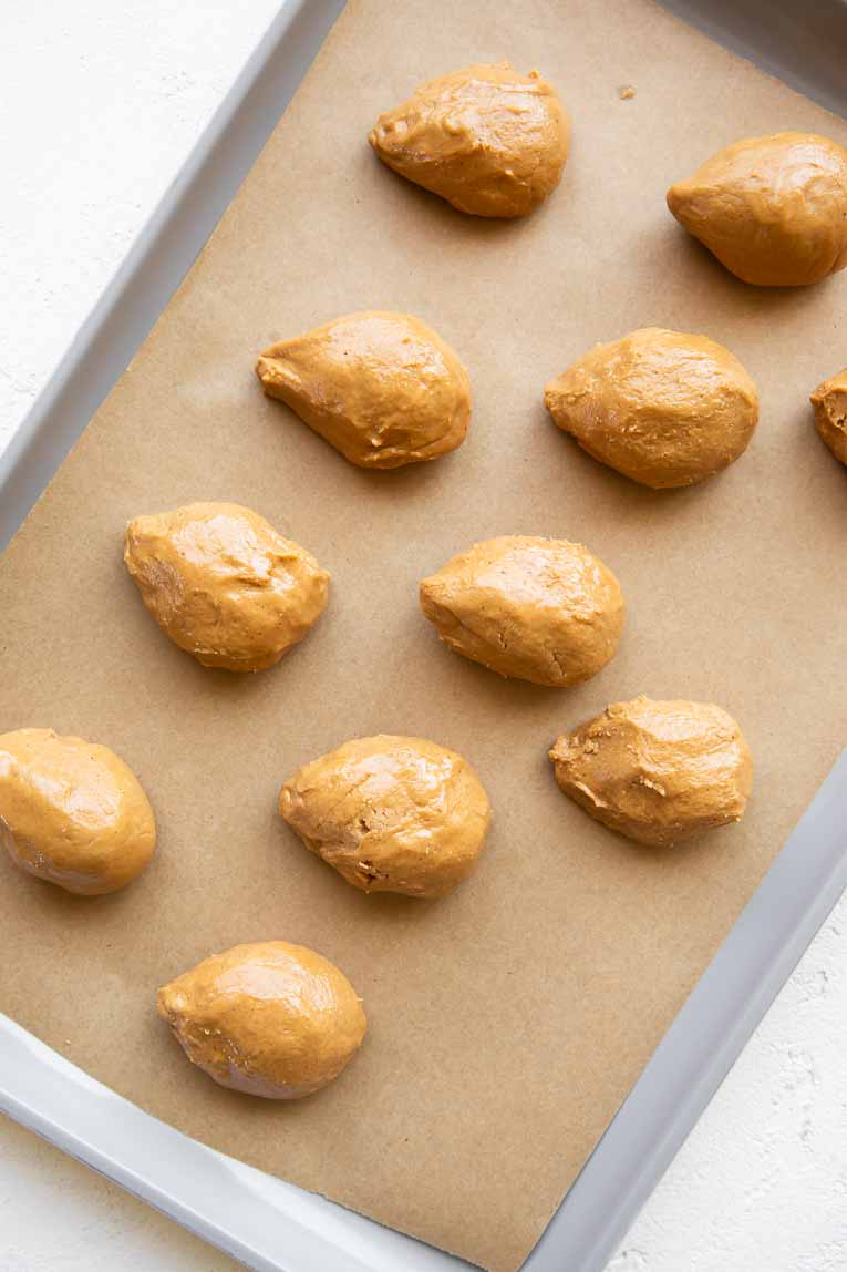 Easter peanut butter eggs on a baking sheet.