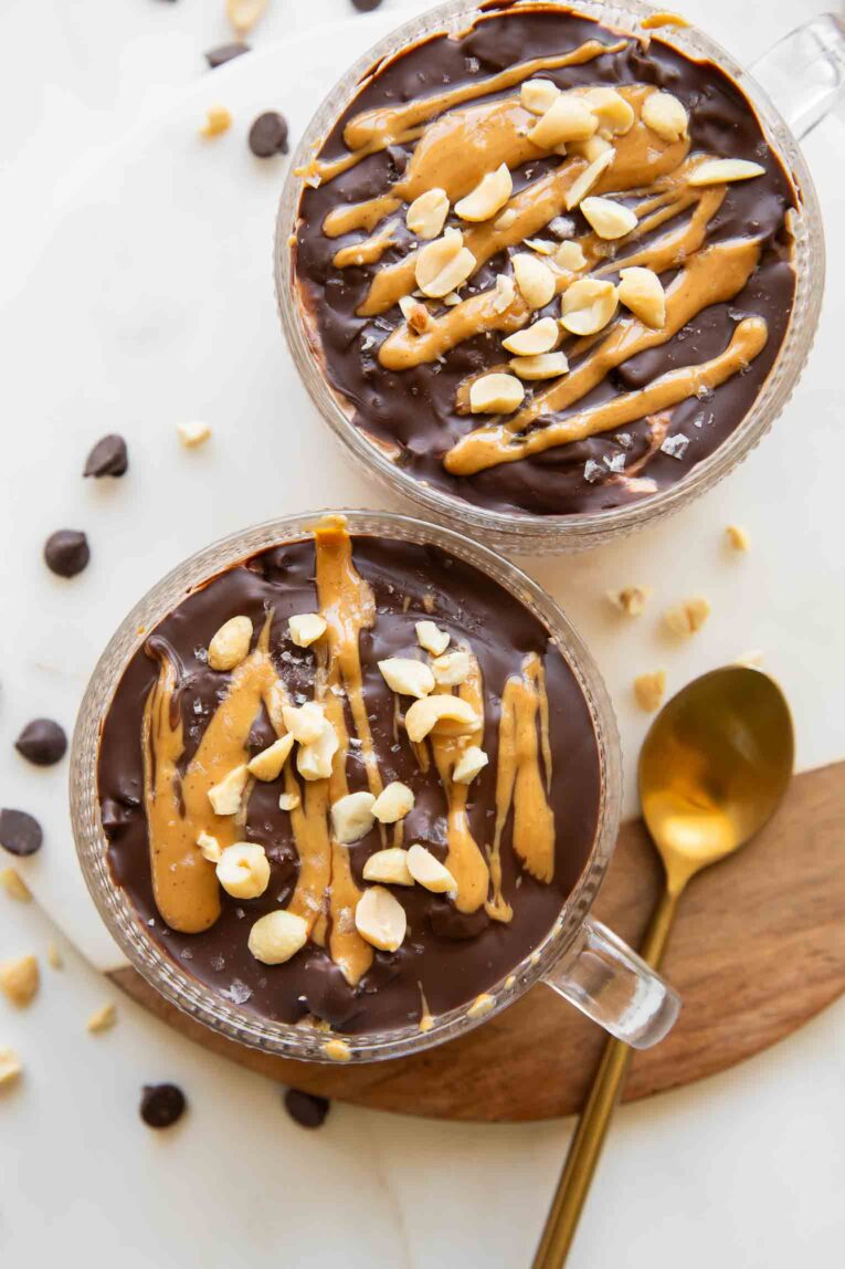 Snickers Overnight Oats with chocolate shell, peanut butter, and chopped peanuts.