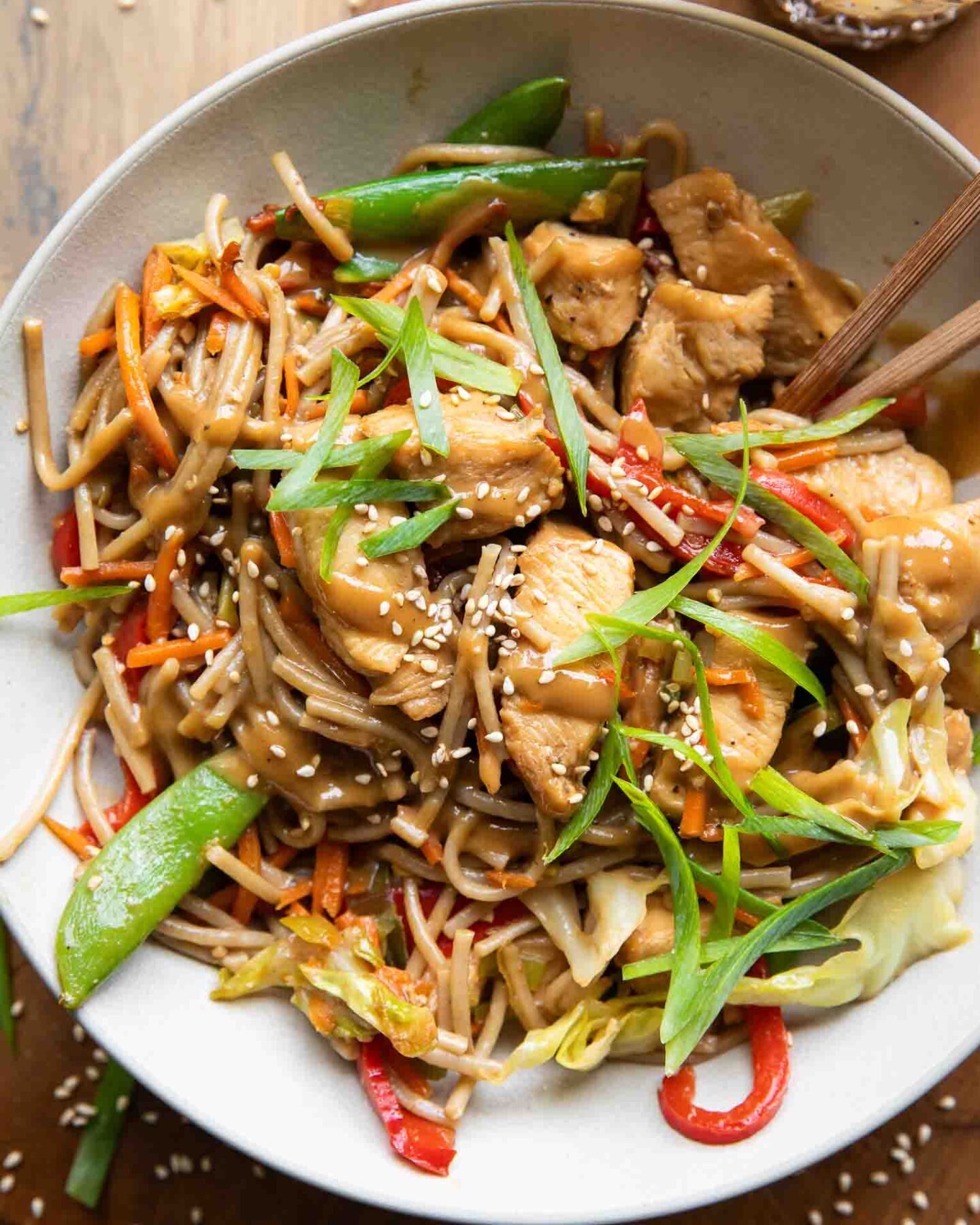 Chicken Lo Mein recipe in a bowl with chopsticks.