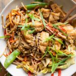 Chicken Lo Mein recipe in a bowl with chopsticks.