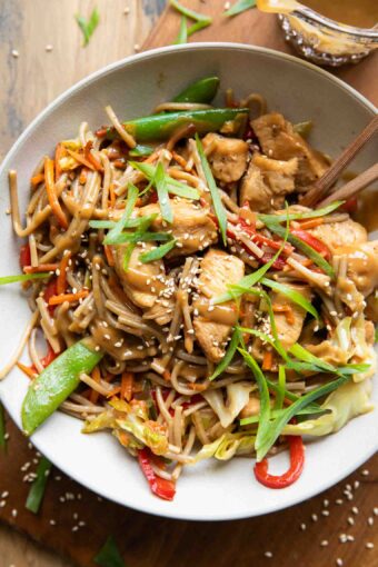 Chicken Lo Mein recipe in a bowl with chopsticks.