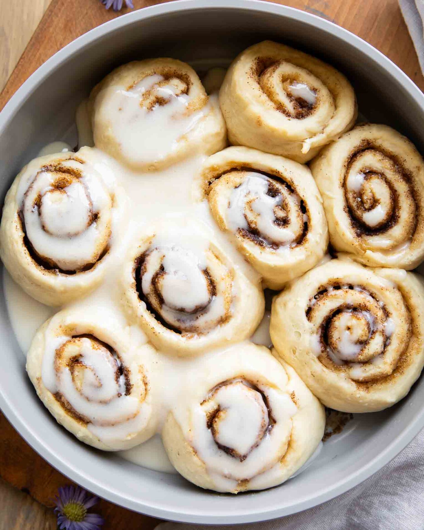 Cottage Cheese Cinnamon Rolls in a pan with glaze.