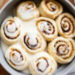 Cottage Cheese Cinnamon Rolls in a pan with glaze.