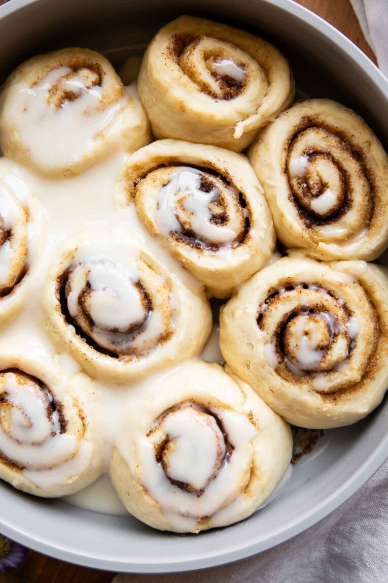 Close up of protein Cottage Cheese Cinnamon Rolls in a cake pan.