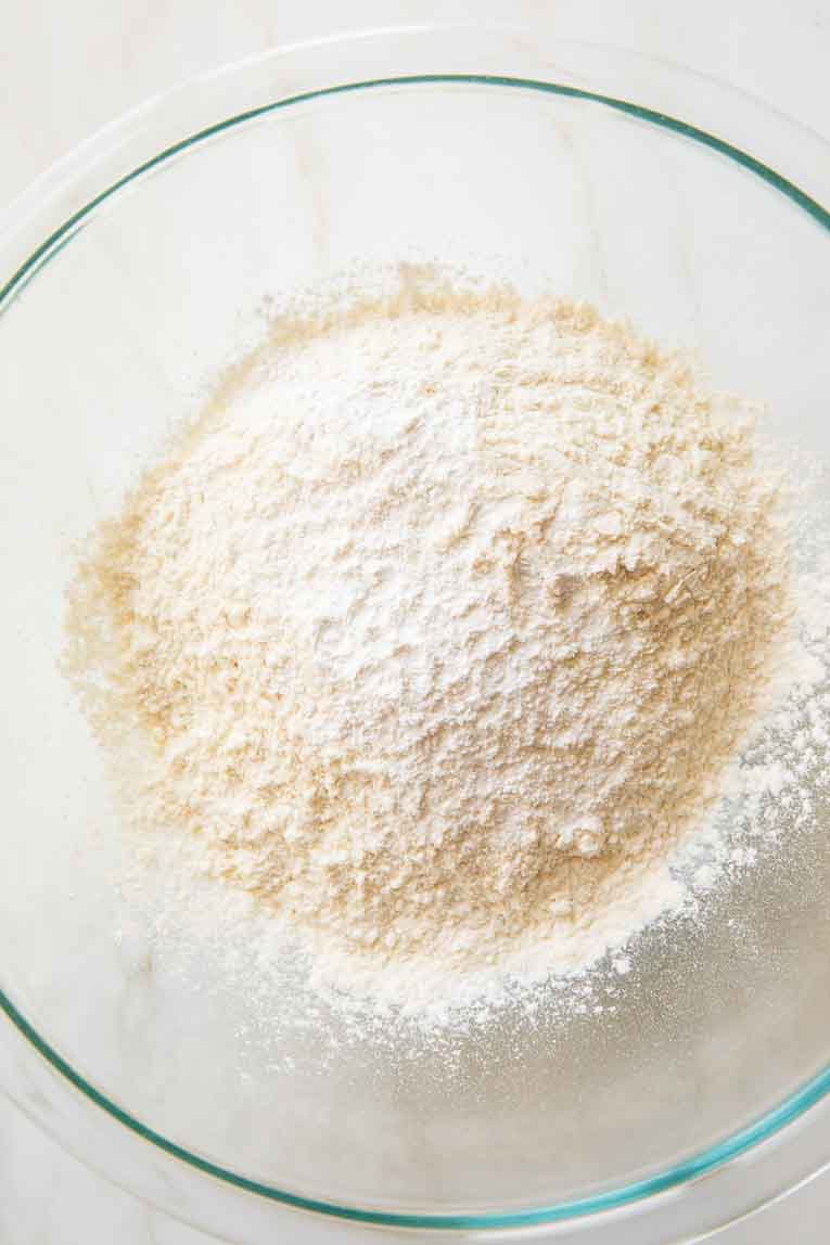 Dry ingredients for Cottage Cheese Cinnamon Rolls in a mixing bowl.
