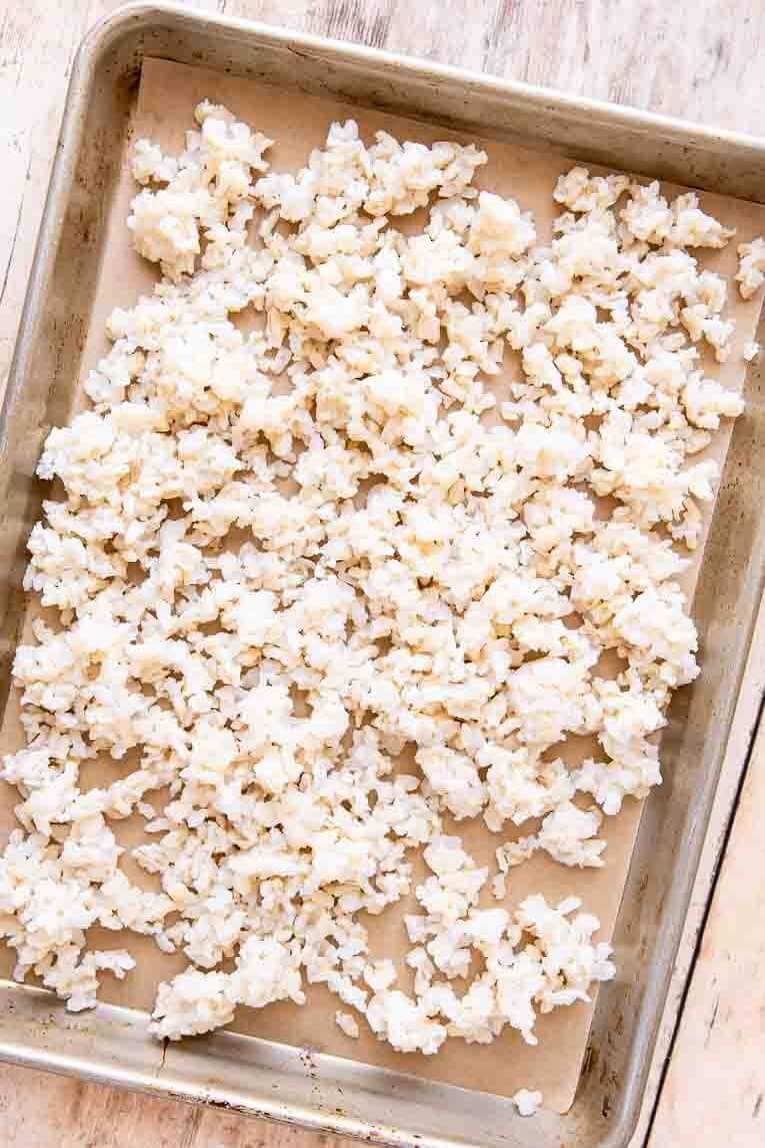 Cooked rice cooling on a pan.