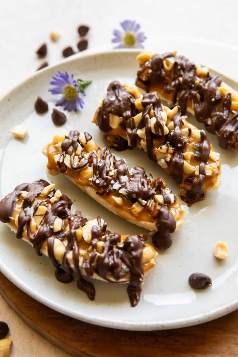 Angled photo of frozen bananas with chocolate.