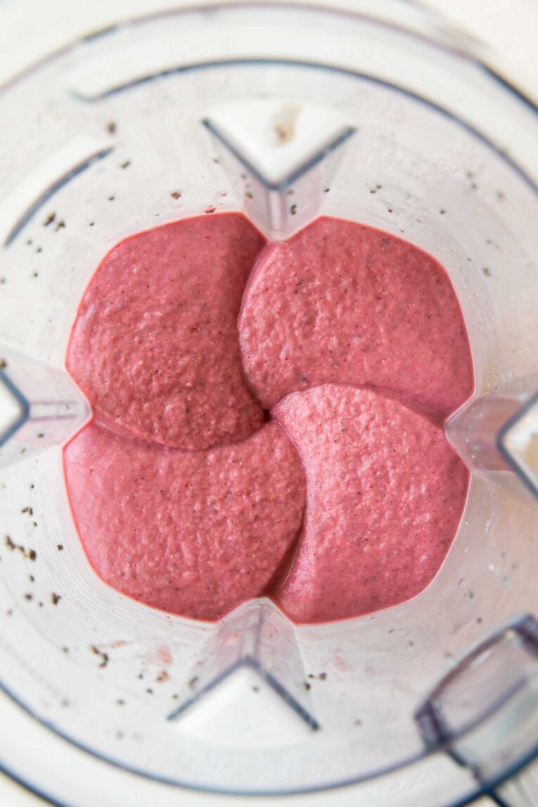 Strawberry Banana Smoothie in a blender with chia seeds.