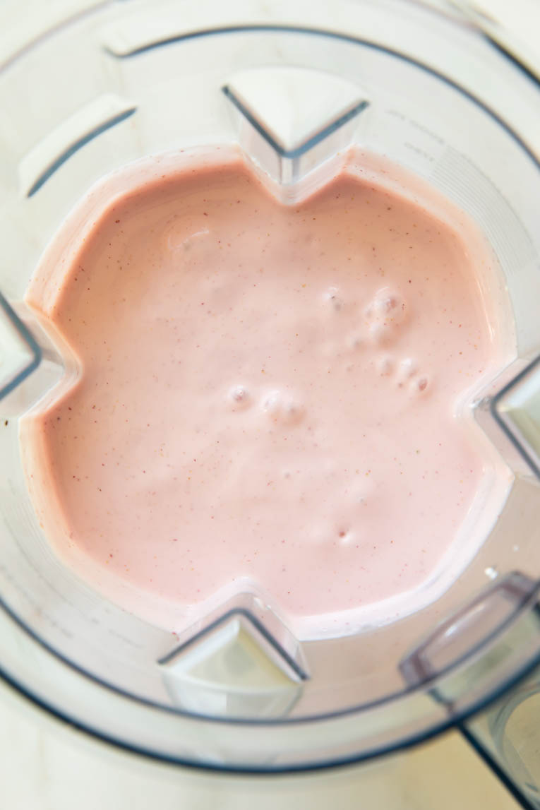 Blended Strawberry Cottage Cheese Ice Cream in a blender.