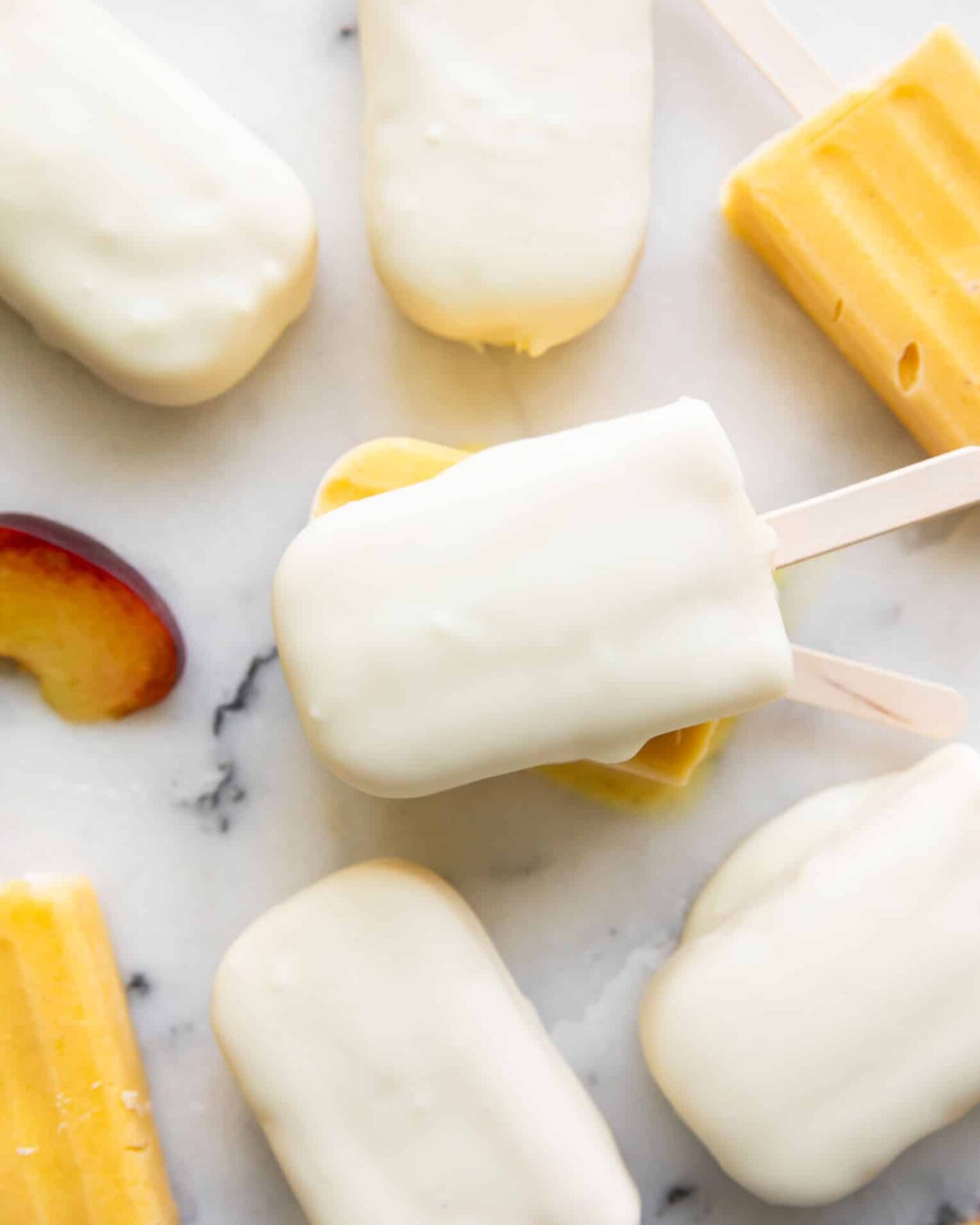 Coconut Peach Magnum Popsicles close up.