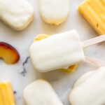 Coconut Peach Magnum Popsicles close up.