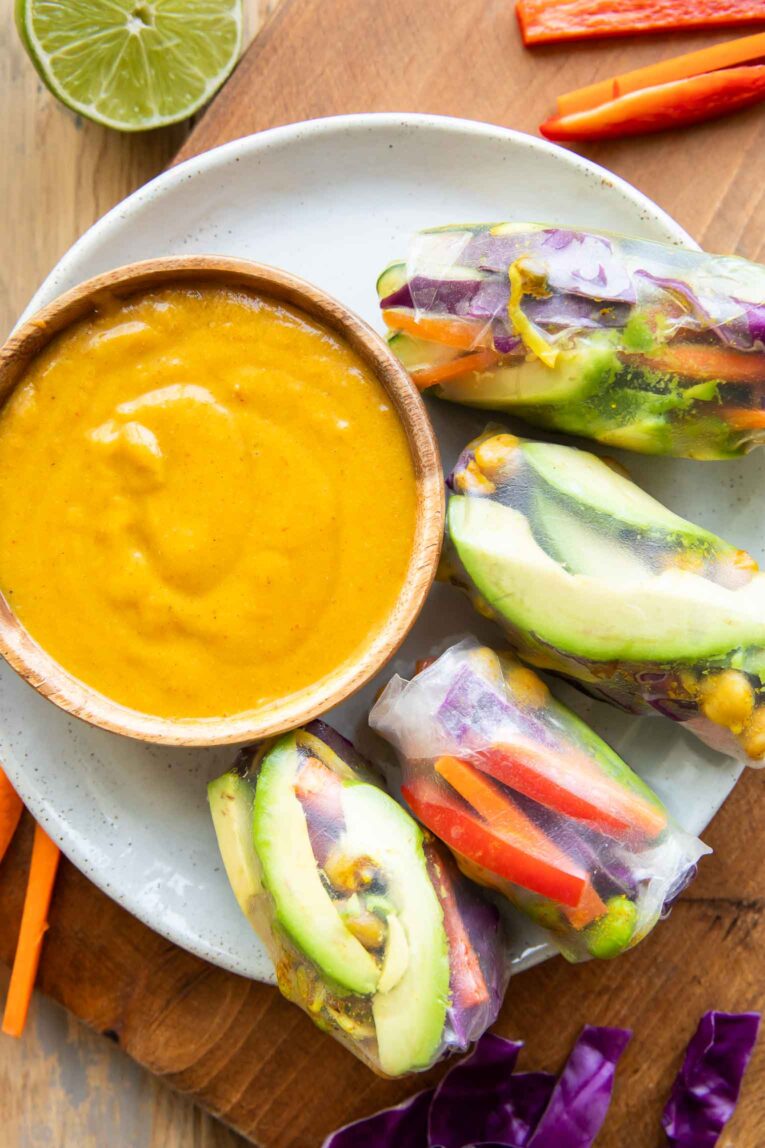 Top photo of Vegan Spring Rolls with coconut sauce.