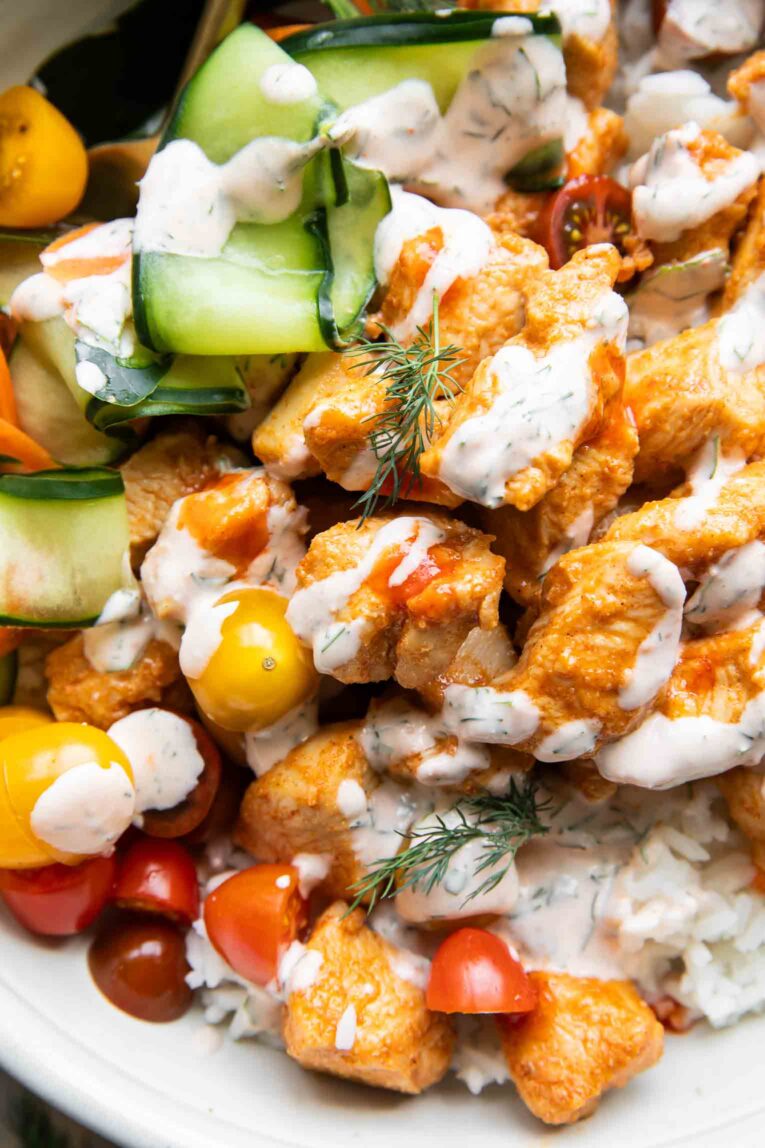 Close up of Sriracha Ranch Chicken with rice and veggies.