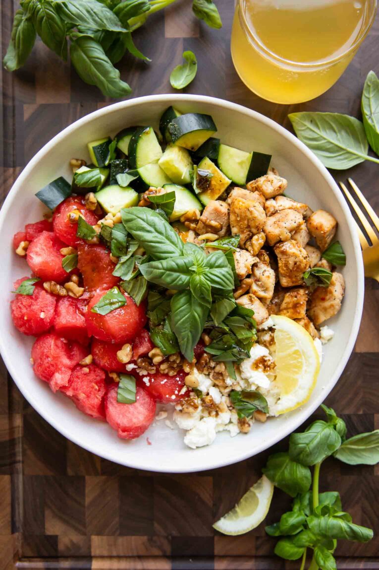 Top photo of Watermelon Feta Salad in a bowl with basil.