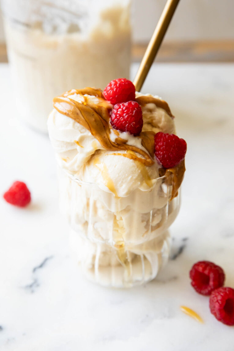Angled photo of scooped Greek Yogurt Ice Cream in a parfait glass.